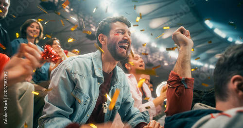 Fotografie Portrait of White Male Soccer Football Supporter With Diverse Male and Female Fa