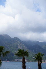 Keuken achterwand Kamperen lake and mountains, beautiful landscape, moody weather, clouds and the sea  © theeve