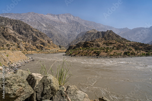 Scenic mountain landscape view of Panj river valley separating Tajikistan and Afghanistan, Darvaz, Gorno-Badakhshan, Tajikistan Pamir