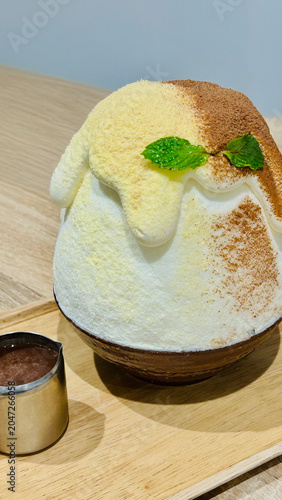 Japanese Kakigori Shaved Ice Dessert with Cream and Cinnamon
