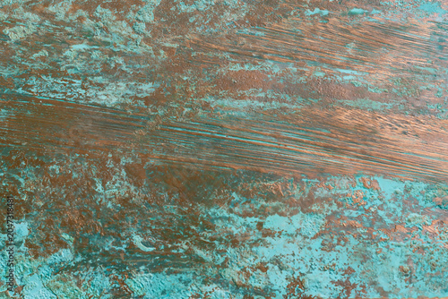 Fotografie Antique weathered copper plate background with vibrant green patina verdigris te