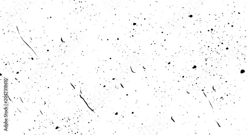 Foto White background with black splatter pattern