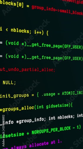 Animated portrait digital screen showing scrolling green and red software programming code for development concepts.