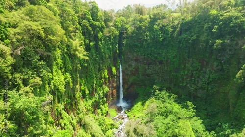 Amazing Beautiful waterfall in tropical rainforest in national park at East Java, Indonesia