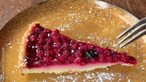 Eating berry cake close up