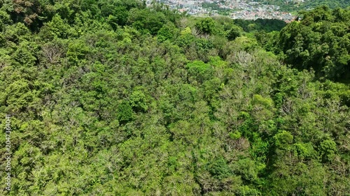 Aerial view Drone fly over Patong city with mountains in the foreground,Patong bay Phuket Thailand,Beautiful sea nature background