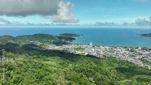 Aerial view Drone fly over Patong city with mountains in the foreground,Patong bay Phuket Thailand,Beautiful sea nature background