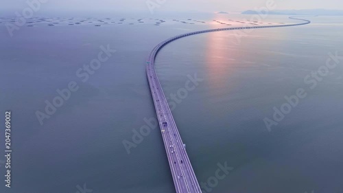 Aerial view of highway light of Penang Second Bridge with dramatic twilight sunset sky background
