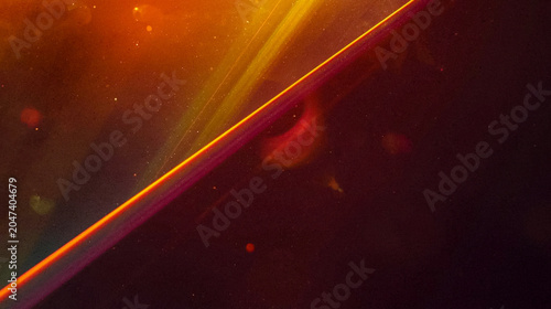 Abstract dark background with glowing diagonal orange light streaks and soft bokeh particles, elegant luxury wallpaper with minimalist aesthetic, cinematic space concept for modern commercial design