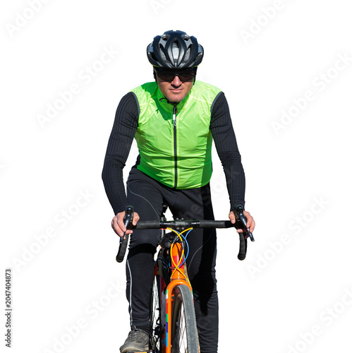 Cyclist riding bicycle on offroad against clear sky. A man in an outfit stands with a bicycle on an autumn sunny day.