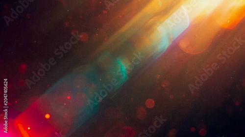 Abstract cinematic light leak background with warm orange and cool blue lens flares, vintage film dust particles, and soft bokeh effects for premium website backdrops and creative media.