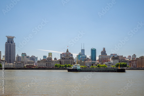 Photos The Bund Historic Skyline and Cargo Ship on the Huangpu River in Shanghai