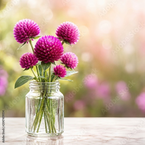 Gomphrena Flowers in Glass Jar With Pollinator Garden Background