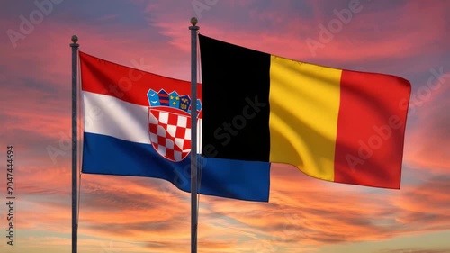 Croatia and Belgium national flags waving together, European partnership and international relations, diplomatic flags at sunset
