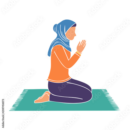 Woman in hijab praying on a prayer mat
