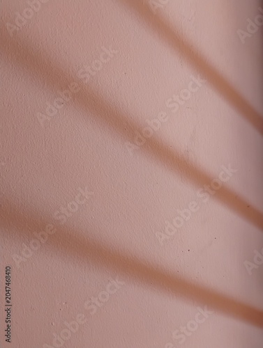 close up of a wall surface with a shadow