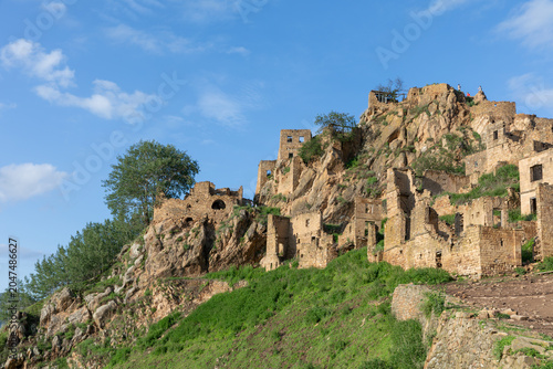 Photos Scenic view of the abandoned mountain village of Gamsutl with stone house ruins
