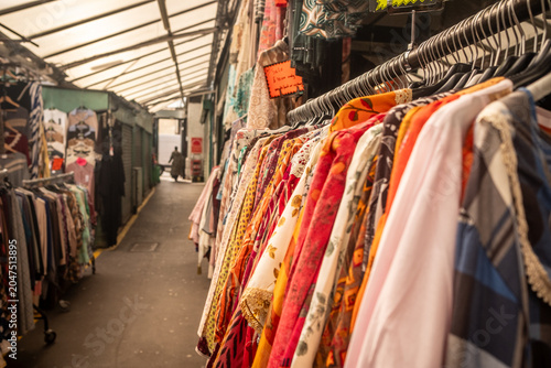 Vászonkép Colourful women's clothing on racks inside Shepherd’s Bush Market in London