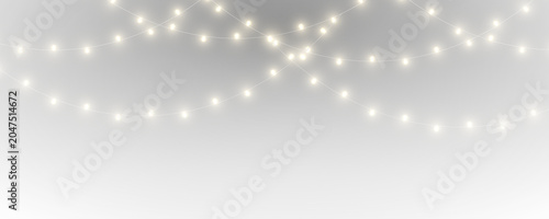Bright Christmas garland glows with realistic light effects. Elegant hanging bulbs enrich winter celebration themes. Transparent background PNG.