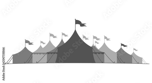 A large circus tent structure with multiple peaks and flags.