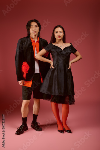 Canvastavla Stylish young couple radiating love and fashion in a vibrant studio setting