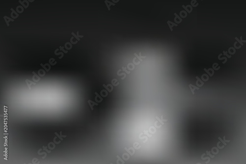 Blurry scene with a dark background and white shapes