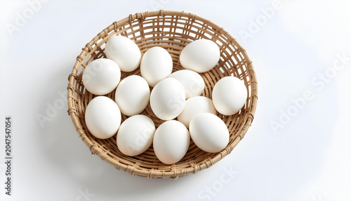 Eggs in natural woven baskets arrangement. isolated on a white background