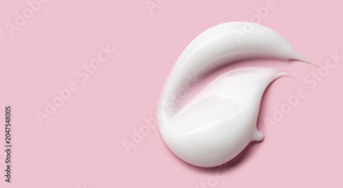 Tableau sur toile cosmetic smear cream texture on pastel pink background