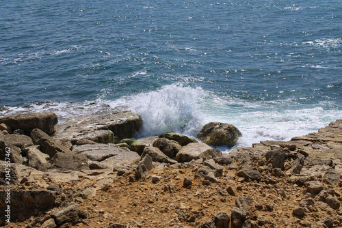 Photography Ocean waves crashing against rocky shoreline at Portland Bill on the Jurassic Co