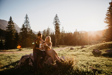 Happy family with little son on a hiking trip having a break, Schwaegalp, Nesslau, Switzerland