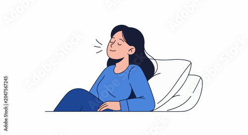 Woman in blue clothing resting peacefully on white pillows, eyes closed