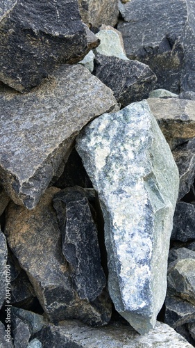 Fotografie Unpolished mountain stones for outdoor masonry work