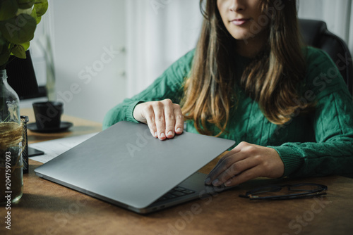 Photography Young Hispanic female secretary starting her workday at the office