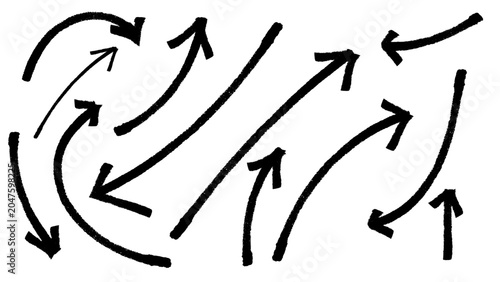 An illustration of multiple hand-drawn black arrows with a rough, brush stroke texture, curving and pointing in various directions on a simple
