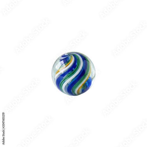 Glass marble with swirling blue, green, and yellow stripes
