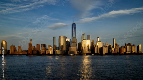 Beautiful skyline view of New York City during golden hour with reflections
