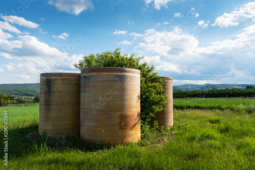Rainwater storage tank in the green field