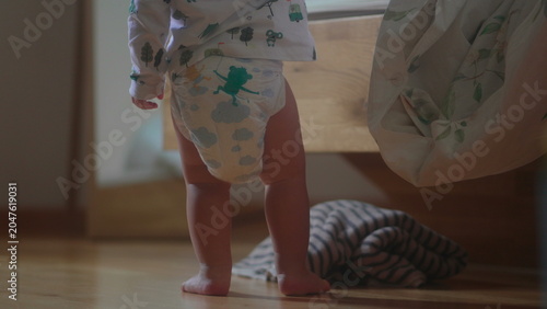 Quadro em tela Toddler getting back up after looking under bed during energetic sibling game at