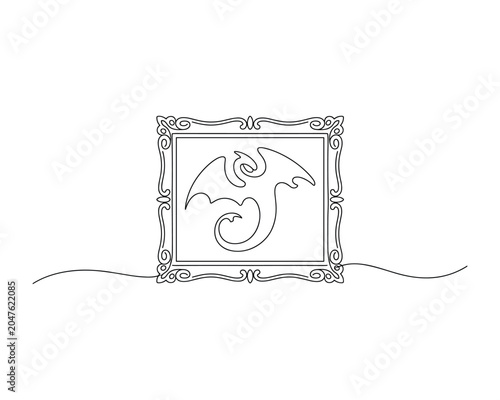 Ornate frame with a dragon design on a plain surface