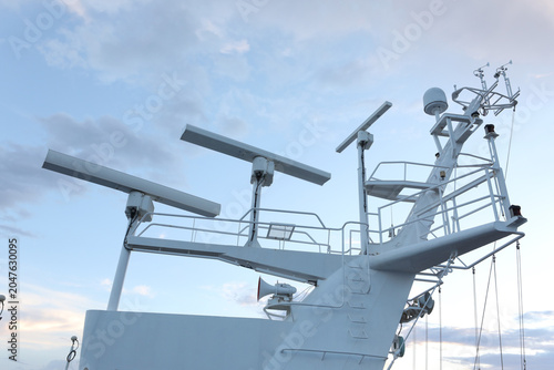 Tableau sur toile White cruise ship mast with marine radar antennas and satellite communication domes