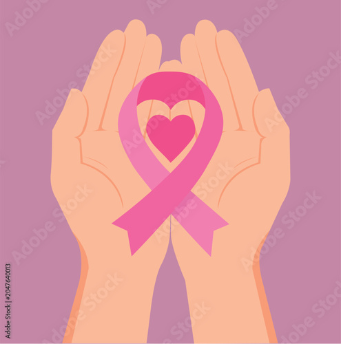 Hands holding pink ribbon supporting breast cancer awareness