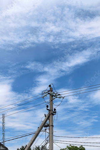 Electrical Utility Pole Under Dramatic Cloud Formation