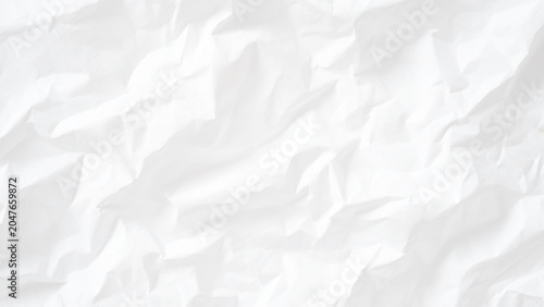 Crumpled white paper texture background with creases and folds