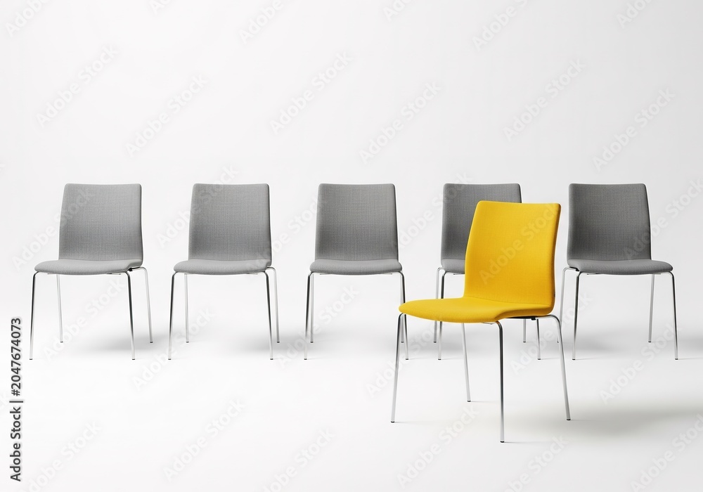 Obraz premium Unique Yellow Chair in Front of Gray Office Chairs Minimalist Studio Background