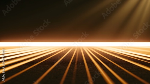 An abstract background featuring warm golden light rays spreading across a dark smooth surface