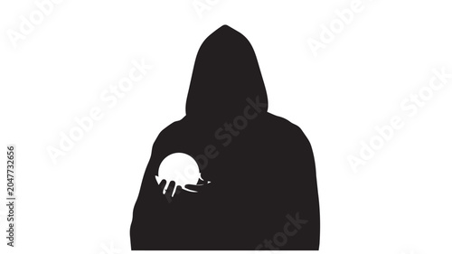 Fotografija Silhouette of a hooded figure holding a glowing crystal ball