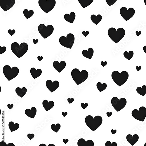 A seamless pattern of black hearts of various sizes on a white background