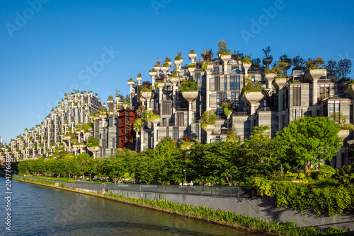 Futuristic 1000 Trees Building with Green Planters and Terraced Architecture on Suzhou Creek in Shanghai, China.
