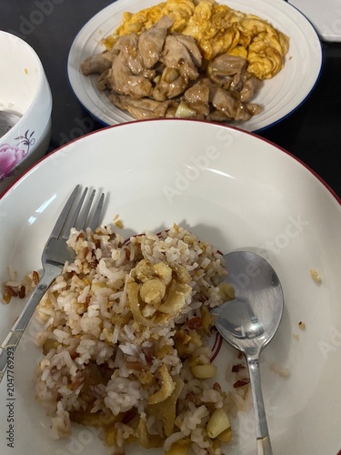 Homemade Thai comfort food set with fried pork and omelet.