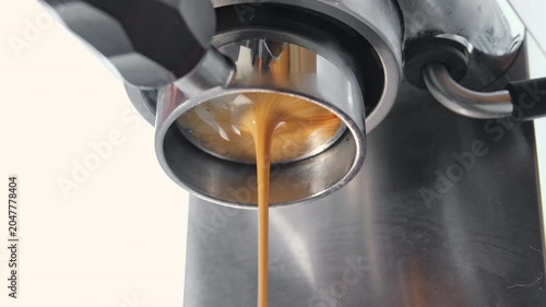 Brewing coffee in an espresso machine, bottomless portafilter